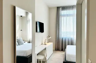 a bedroom with a mirror and a bed and a desk at BRAND NEW TOP FLOOR IN THE HEART OF MIAMI in Miami