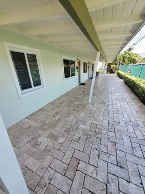 an empty patio of a house with a roof at The Hideaway at Lake Ridge 1 in Fort Lauderdale