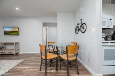 a dining room with a table and chairs in a kitchen at The Palms at Middle River Terrace 2 in Fort Lauderdale