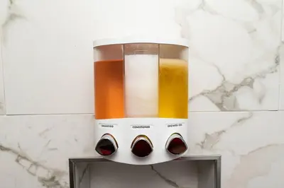 a blender on a counter with three different colored liquids at The Palms at Middle River Terrace 1 in Fort Lauderdale