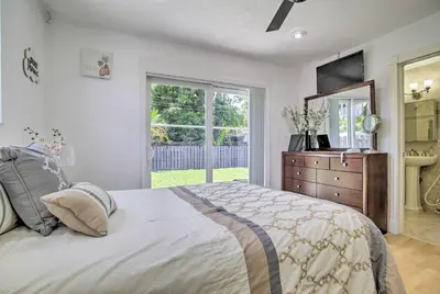a bedroom with a bed and a dresser and a window at Fort Lauderdale Duplex about 5 Mi to Downtown! in Fort Lauderdale