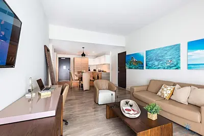 a living room with a couch and a table at Rooftop Pool, Broad-walk & Near Beach in Hollywood