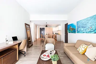 a living room with a couch and a table at Rooftop Pool, Broad-walk & Near Beach in Hollywood