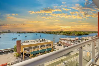 a view of the water from a balcony of a harbor at Hollywood Beach - Front Bay View - Amazing Pool in Hollywood