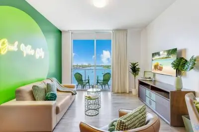 a living room with a couch and chairs at Lovely Apartment-Rooftop Oasis - Bay View in Hollywood