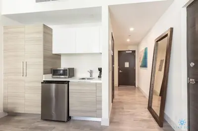 a kitchen with a sink and a microwave at Rooftop Pool - Hot Tub - Hollywood Beach Broad - walk in Hollywood