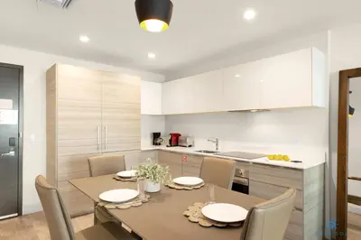 a kitchen and dining room with a table and chairs at Rooftop Pool - Balcony - Hollywood Beach Boardwalk in Hollywood