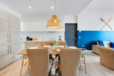 a kitchen and dining room with a table and chairs at Ocean View Balcony - Rooftop Pool & Hot Tub - Gym in Hollywood
