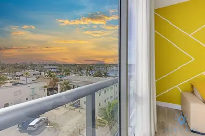 a balcony with a view of a city at Lovely Apartment - Hollywood Beach - Rooftop Pool in Hollywood