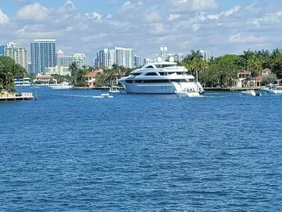 a yacht is docked in a large body of water at WaterFront 4BR 3B,Intercoastal,Pool,5 min walk to beach-7 in Fort Lauderdale