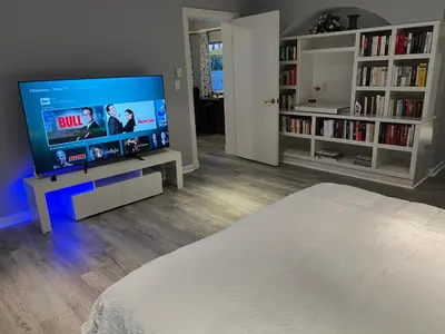 a living room with a large flat screen tv at WaterFront 4BR 3B,Intercoastal,Pool,5 min walk to beach-7 in Fort Lauderdale
