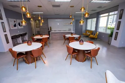 a room with tables and chairs in a building at Gorgeous 2BR in the Heart of Brickell, Free Parking in Miami