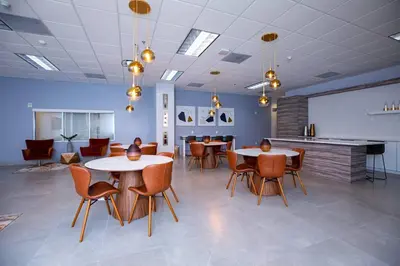 a meeting room with tables and chairs and a whiteboard at Gorgeous 2BR in the Heart of Brickell, Free Parking in Miami