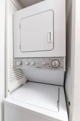 a white microwave oven sitting in a refrigerator at 4BR APT with Bay View at Brickell, Free Parking in Miami