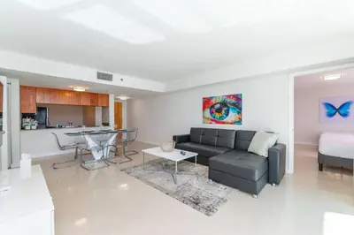 a living room with a couch and a table at Stunning 2BR with Ocean View at Brickell, Free Parking in Miami