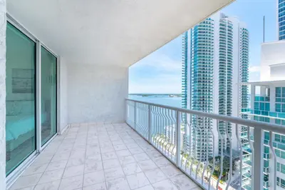 a balcony with a view of the ocean at Bright and Cozy 2BR at Brickell, Free Parking in Miami