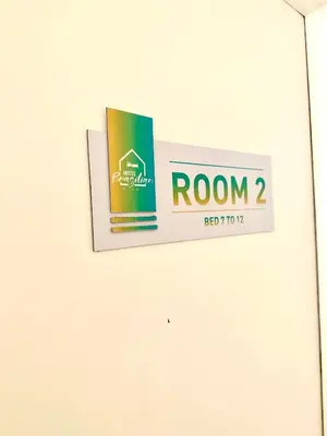 a sign for room on a wall at Miami House in Miami