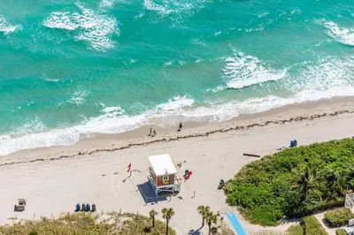 an overhead view of a beach with a food truck at Amazing apartments at Lyfe Resort & Residences in Hollywood