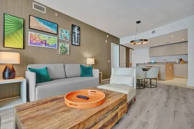 a living room with a couch and a table at Amazing apartments at Lyfe Resort & Residences in Hollywood