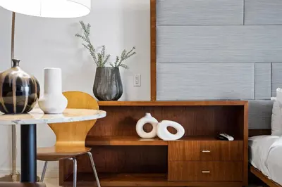 a bedroom with a bed and a table with vases at Biscayne Bay View Stay Pool Hot Tub and Amenities in Miami