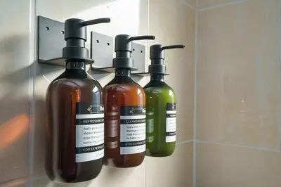 a couple of bottles of soap on a wall at Blue Door Duplex Renovated Parking and Designed in Cutler Bay
