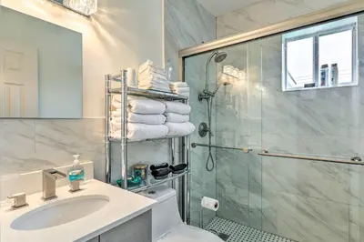 a bathroom with a shower and a sink and a toilet at Central Miami Home about 10 Mi to Local Beaches! in Miami