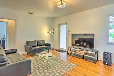 a living room with a couch and a fireplace at Central Miami Home about 10 Mi to Local Beaches! in Miami
