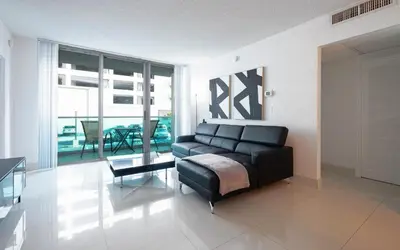 a living room with a couch and a table at YP PROPERTY MANAGEMENT in Hollywood