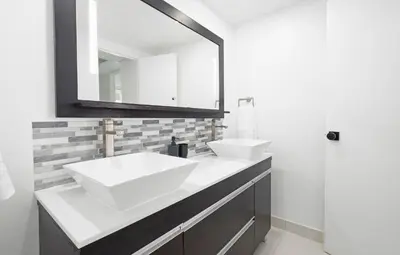 a bathroom with two sinks and a mirror at YP PROPERTY MANAGEMENT in Hollywood