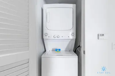 a washer and dryer sitting on top of a refrigerator at Insane Ocean View Balcony- Beachfront Resort - Pools in Hollywood