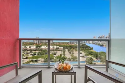 a bowl of fruit on a table on a balcony at Spectacular Balcony plus Near Beach, Gym, Pool in Hallandale Beach