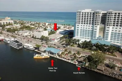 a view of a city with a boat in the water at Shell on the Beach 106 - RENOVATED in Hollywood