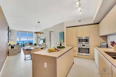 a large kitchen with a dining room and an open floor plan at Ocean View Balcony, Beachfront Resort, Amazing Pool in Hollywood