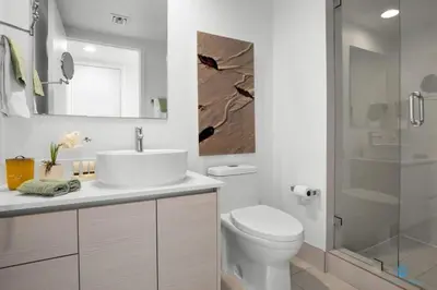 a bathroom with a sink and a toilet and a shower at Infinite View with Balcony, Pool, Gym plus Near Beach in Hallandale Beach