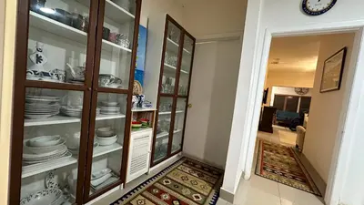 a china cabinet with plates and dishes in it at Private Rooms in Miami