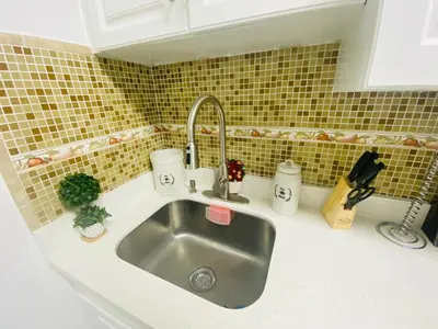 a kitchen counter with a sink in a kitchen at Relax 521 in Miami