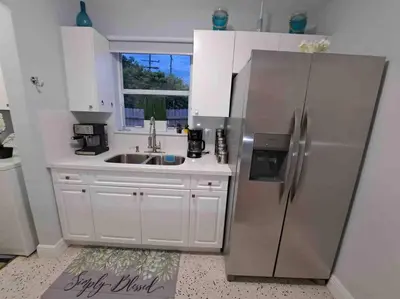 a kitchen with a stainless steel refrigerator and a sink at Relax 523 in Miami