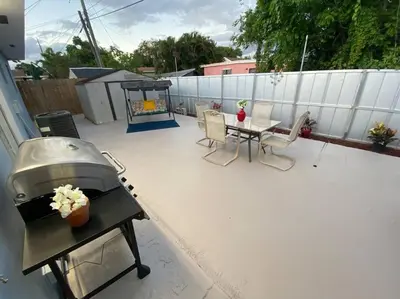 a patio with a grill and a table and chairs at Relax 523 in Miami