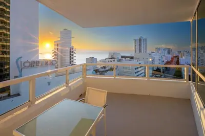 a balcony with a table and a view of the city at Fontainebleau Hotel Ocean View Fits 6! 1 BED/2 BA in Miami Beach
