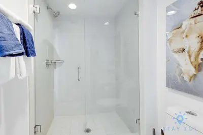 a white bathroom with a shower and a sink at BeachWalk Resort, Views, Balcony, Studio in Hallandale Beach