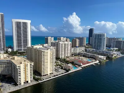an aerial view of a city next to the water at Miami Beach Glam, Ocean Views & Elegance -28B in Hallandale Beach