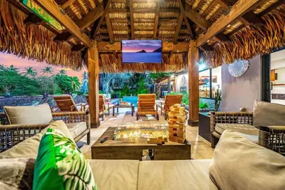 a living room with couches and a tv on a ceiling at Pool and Waterfront Oasis in Fort Lauderdale