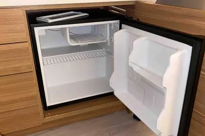 an empty refrigerator with its door open in a kitchen at Beachy Vibes Studio, 2 Full Beds, Near Everything -30B in Hallandale Beach