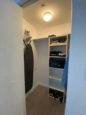 a room with a walk in closet with a closet at Sunlit BeachWalk Studio 2 Full Beds Coastal Charm -26B in Hallandale Beach