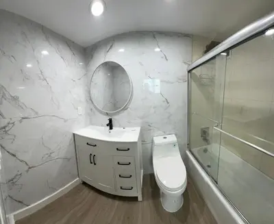 a bathroom with a sink and a toilet and a mirror at The Tides! On the beach, Sea view! in Hollywood
