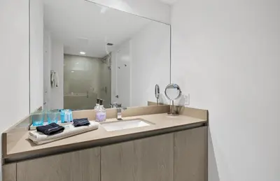 a bathroom with a sink and a mirror at Lyfe Oceanview Resort Luxury 2 Bedroom Unit in Hollywood