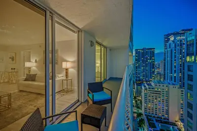 a room with a balcony with a view of a city at High Floor Unit Located in Brickell - Free Parking in Miami