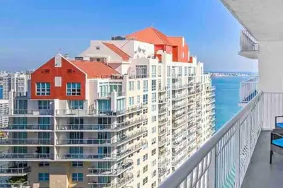 a view of a large building on a balcony at High Floor Unit Located in Brickell - Free Parking in Miami