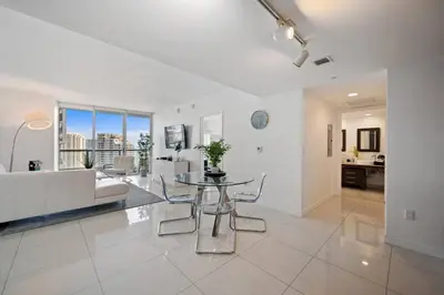 a living room with a table and a couch at Iconic Icon W Unit - Pool & Ocean Views in Miami