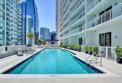 a swimming pool in the middle of a building at INCREDIBLE OCEAN VIEW 3 BEDROOMS UNIT in Miami